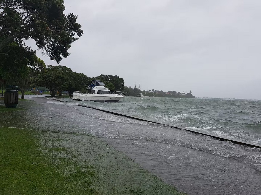 The sea flooding on to normally dry land in Tauranga Harbour during rough seas at high tide. The sea flooding on to normally dry land in Tauranga Harbour during rough seas at high tide.